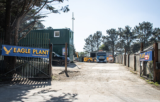 The entrance to Eagle Plant Redrith, large open yard with eagle plant sign, offices to the left and lorry in the yard.